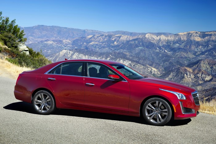 Red 2014 Cadillac CTS Vsport Sedan on Mountain Road