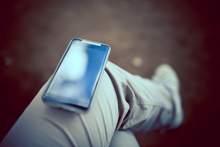 Smartphone on a person's leg