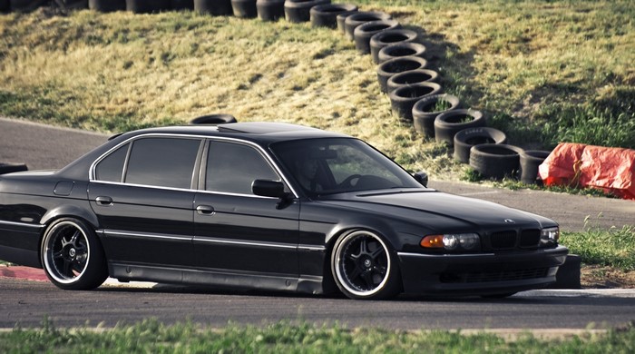Black BMW 740i E38 on a Racetrack