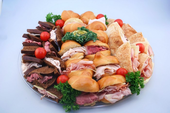 Sandwich platter with assorted sandwiches and rolls