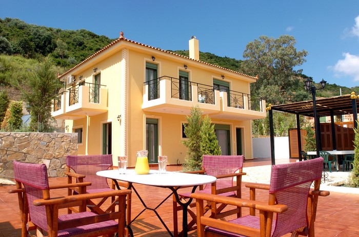Yellow House with Outdoor Seating Area in Greece