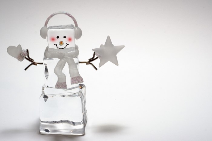 Ice snowman with headphones and scarf holding a star