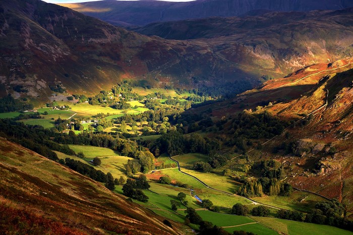 Valley landscape with rolling hills and scattered trees