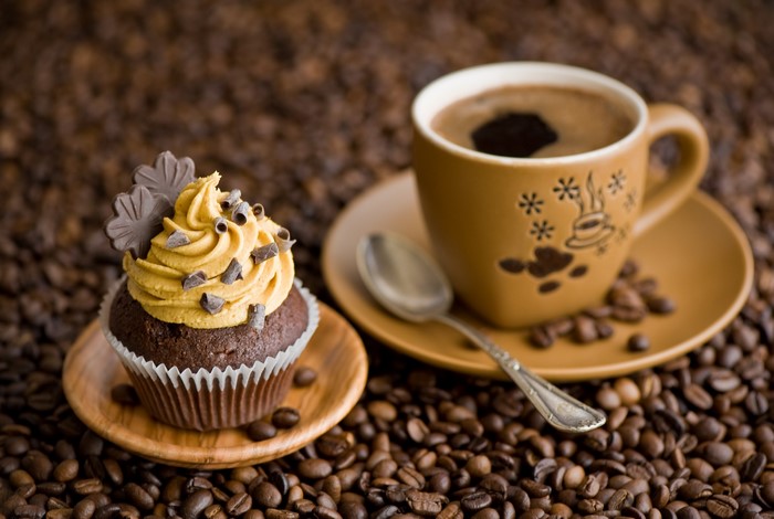 Cupcake and coffee with coffee beans