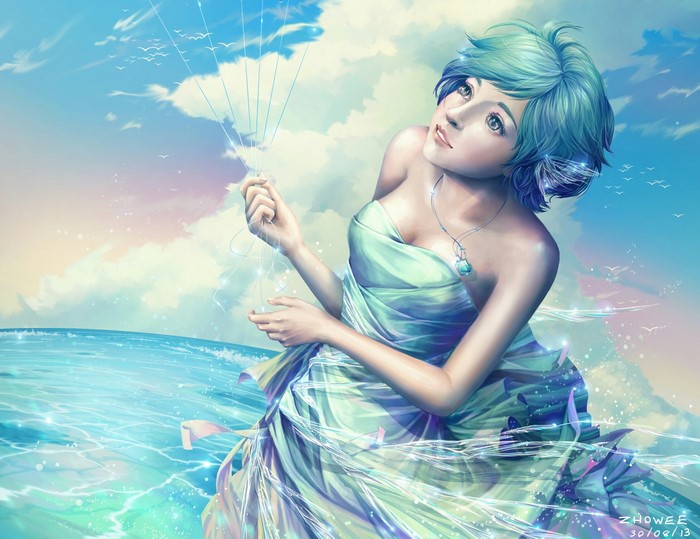 Woman in flowing dress by the sea