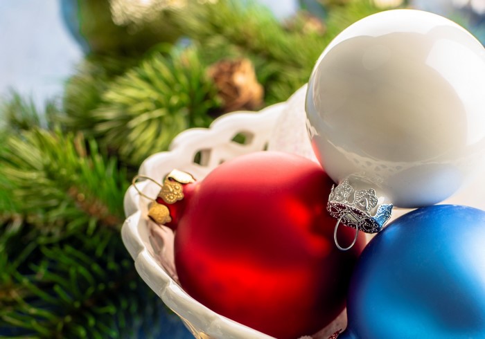 Christmas Ornaments in a Bowl with Pine Branches