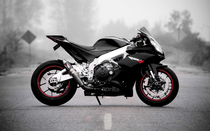 Black Aprilia Motorcycle on a Road