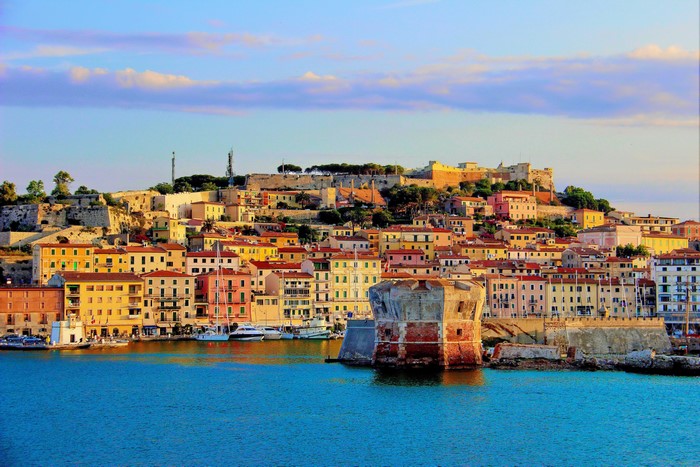 Portoferraio, Italy harbor with colorful houses and fortress