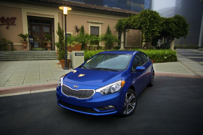 Blue 2014 Kia Forte EX GDI parked outside building