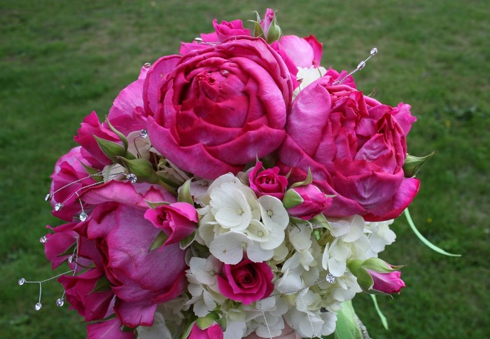 Pink roses and white hydrangea bouquet with crystals