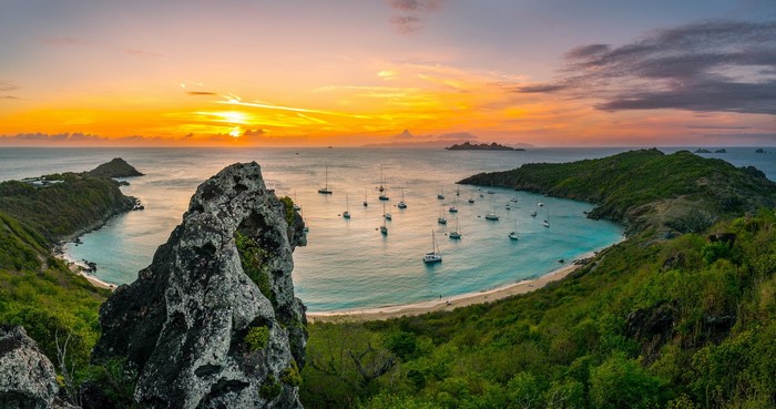 Bay with sailboats at sunset