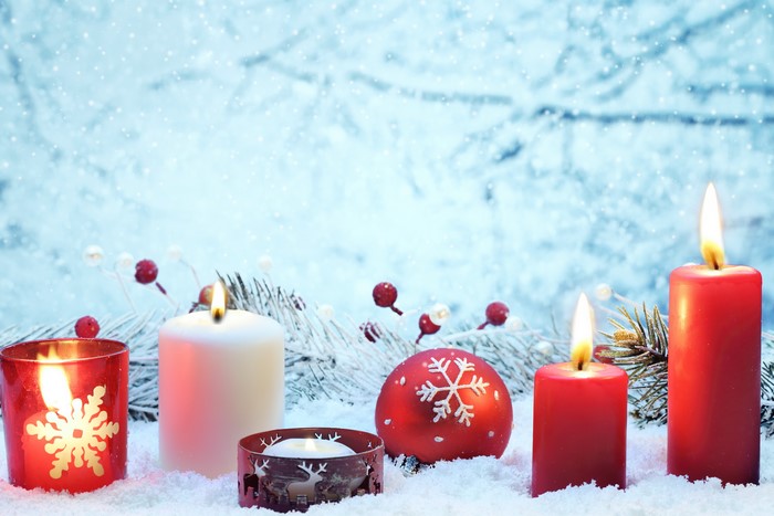 Christmas Candles and Ornaments in Snow