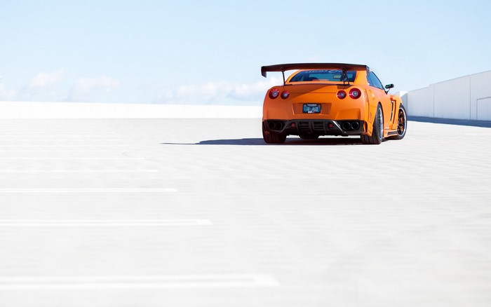 Orange Nissan GT-R R35 with a large rear wing