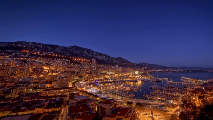 Monaco cityscape with marina at night
