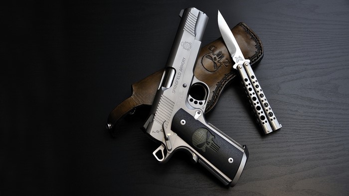 Springfield Armory 1911 pistol and butterfly knife