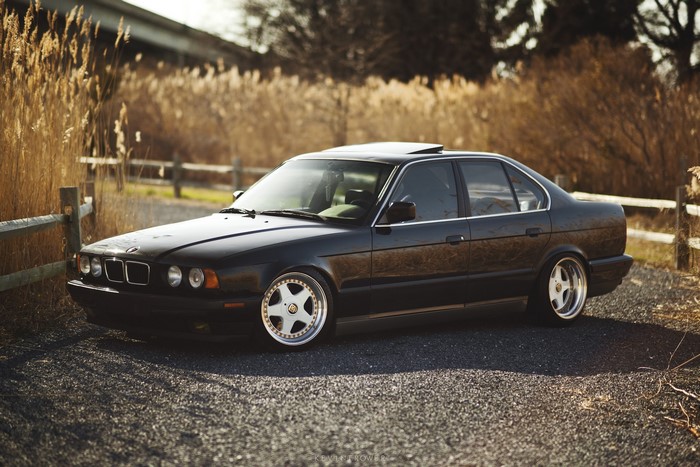 Black BMW E34 525 parked outdoors