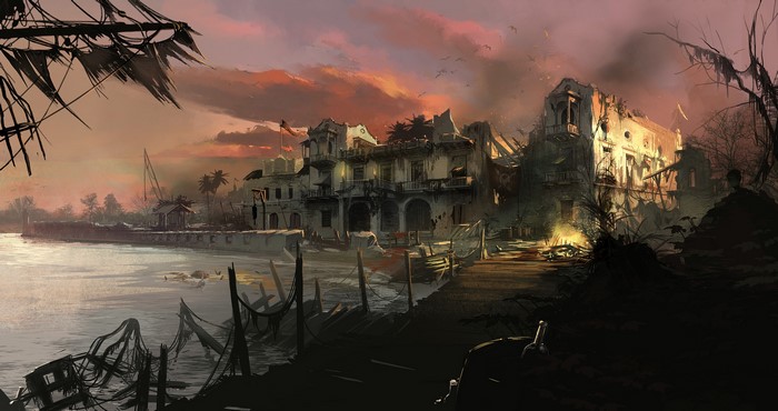 Ruined buildings by the water at sunset