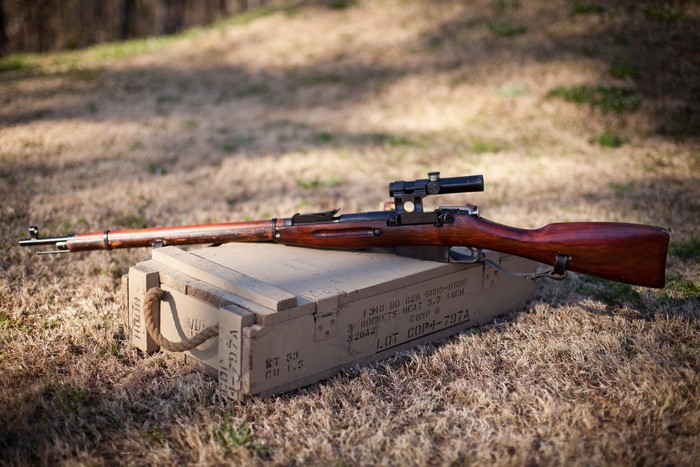 Sniper rifle on a wooden crate