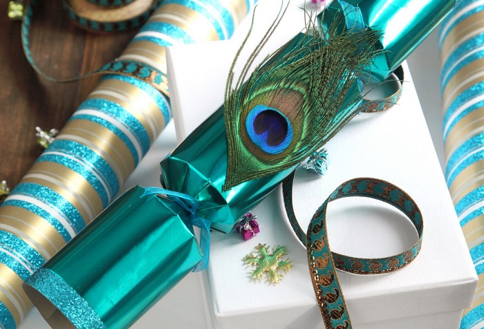 Christmas crackers with peacock feather and ribbon