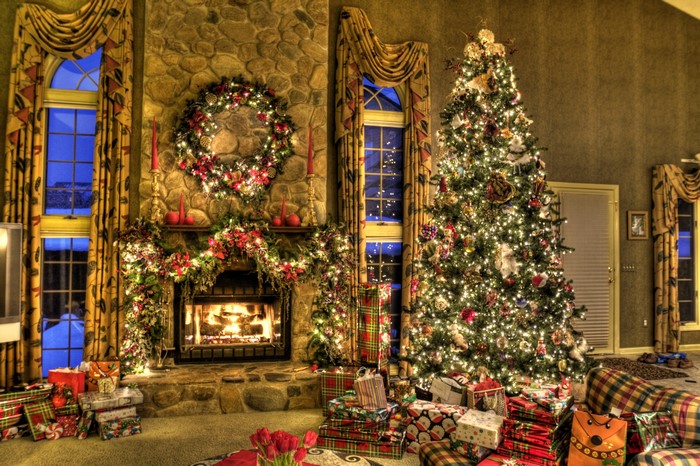 Christmas tree and fireplace decorated for the holidays