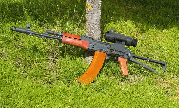 AK-74 assault rifle with scope on grass