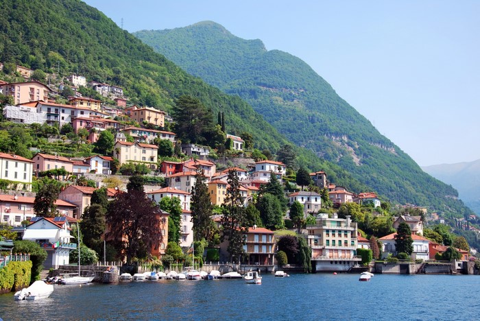 Houses on a mountainside overlooking a lake in Como, Italy