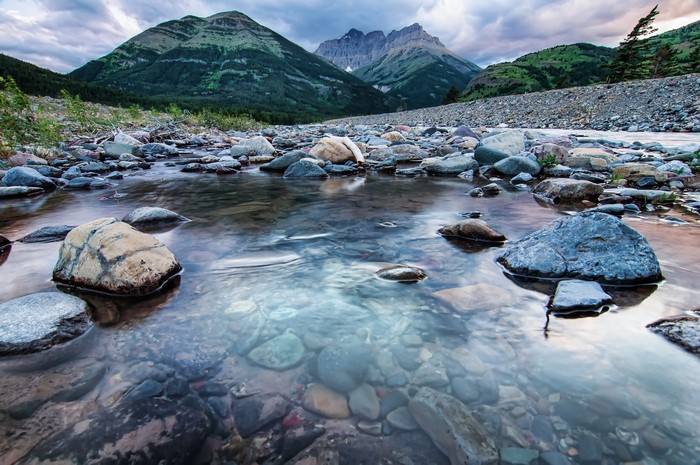 River stones and mountains in Waterton Alberta, Canada