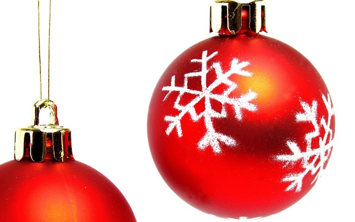 Two red Christmas ornaments with snowflakes