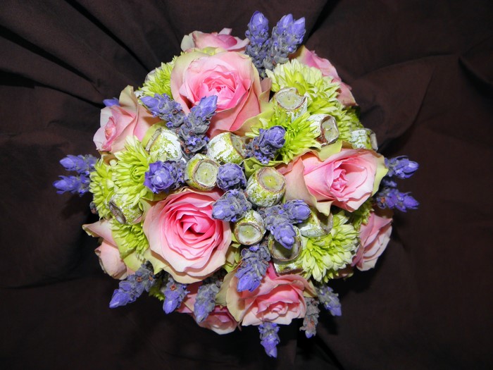 Bouquet of pink roses, green chrysanthemums, lavender, and dried seed pods