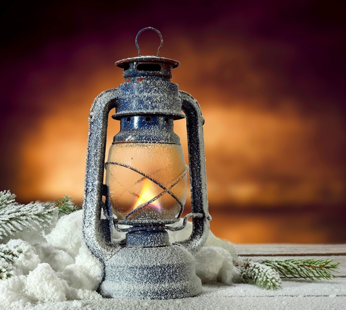 Kerosene lamp with fire and snow