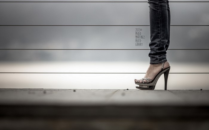 Woman in Jeans and Stilettos on Wooden Deck