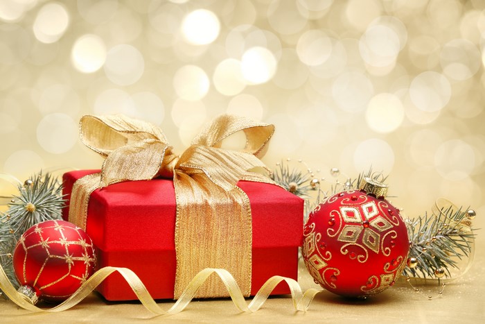 Christmas gift box with ornaments and pine branches