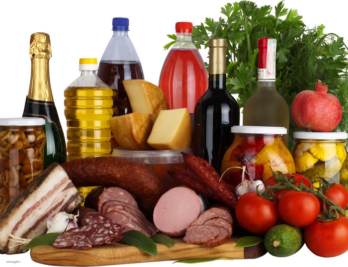 Still life with sausage, tomatoes, wine, champagne, cheese, and bottles