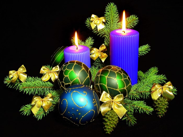 Christmas candles with ornaments and pine branches