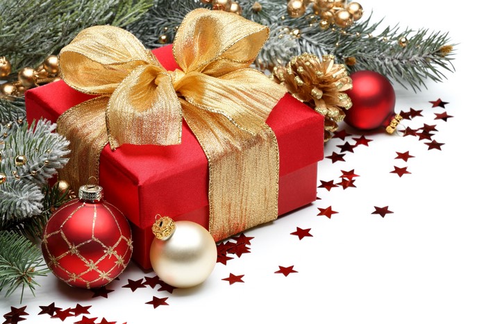 Christmas gift with ornaments and pine branches