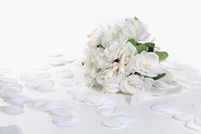 White rose bouquet with scattered petals