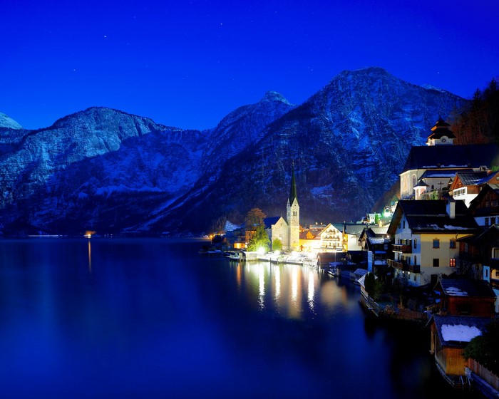 Hallstatt village at night with mountains and lake