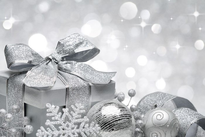 Christmas gift with silver ornaments and bokeh
