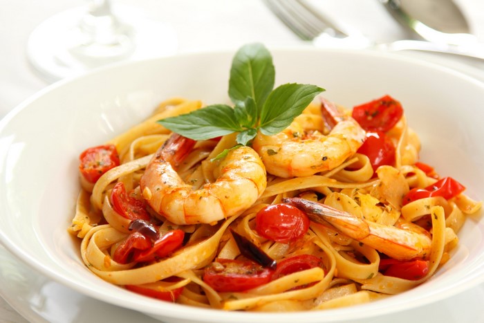 Shrimp and pasta with tomatoes and basil