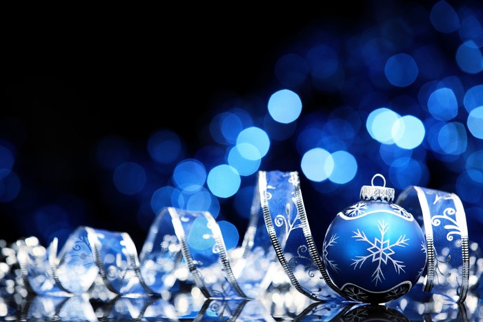 Christmas ornament and ribbon with blue bokeh