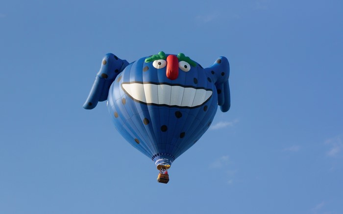 Blue monster hot air balloon flying in the sky