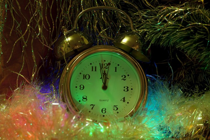 Alarm clock near Christmas decorations