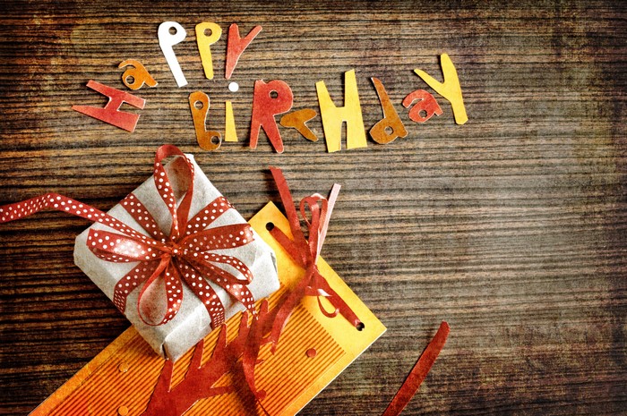 Happy Birthday Gift on Wooden Background