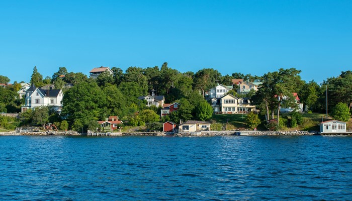 Houses on a tree-covered island in Sweden