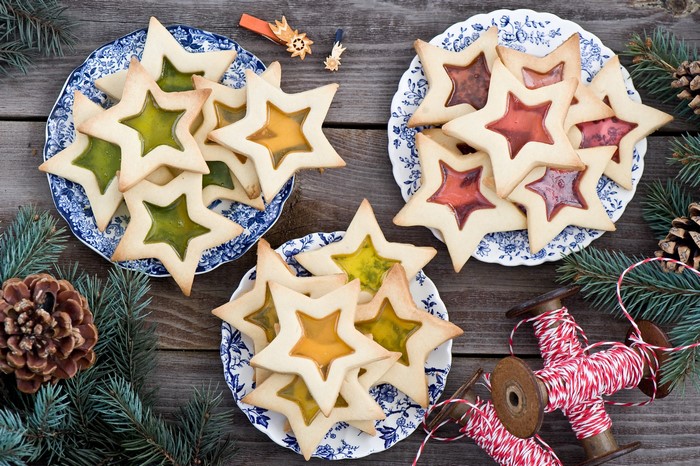 Star-shaped stained glass cookies on plates