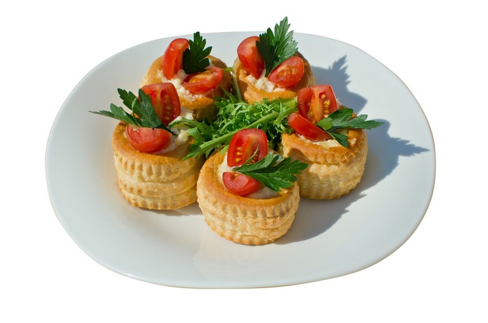 Vol-au-vents with tomatoes and parsley on a plate