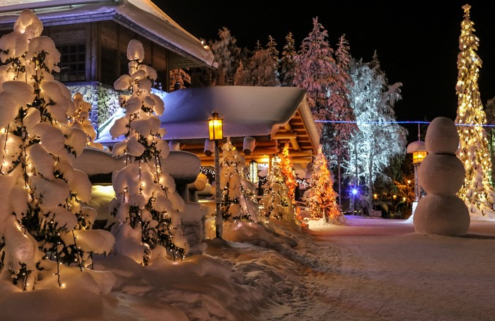 Winter scene in Lapland, Finland with Christmas lights