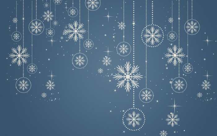 Hanging snowflakes and star ornaments on a blue background