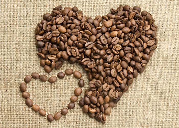 Coffee beans in heart shape on burlap