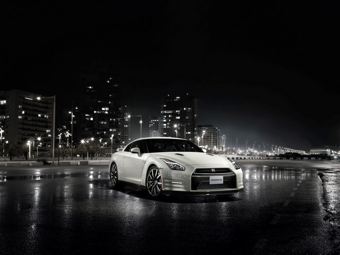 White Nissan GT-R parked at night in a city